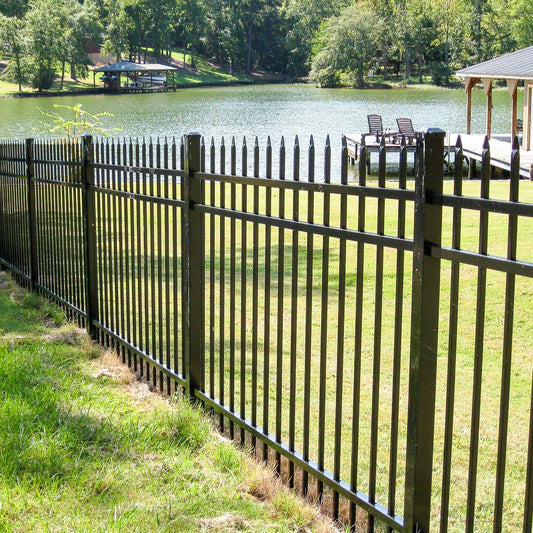 Pressed spear extruded bottom, three rail, fencing near a lake