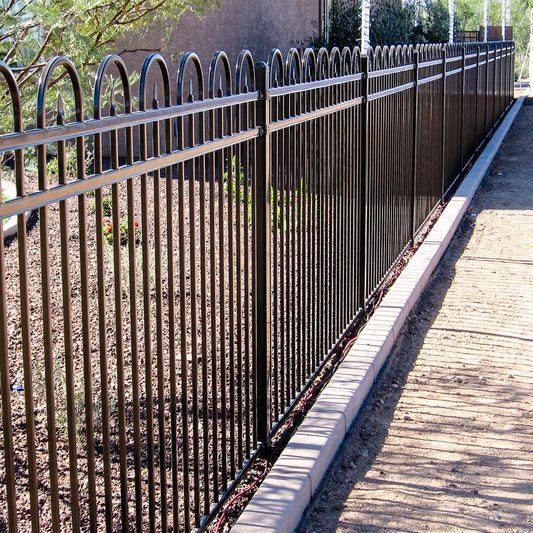 Ornamental fencing in front of the house along the curb
