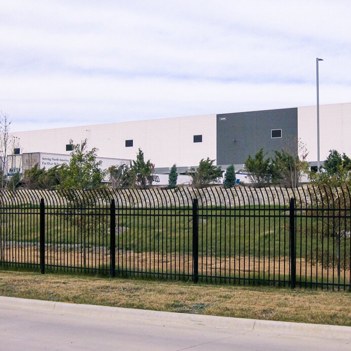 Anti-climb three rail pressed spear, extruded, bottom fencing around a cross dock facility