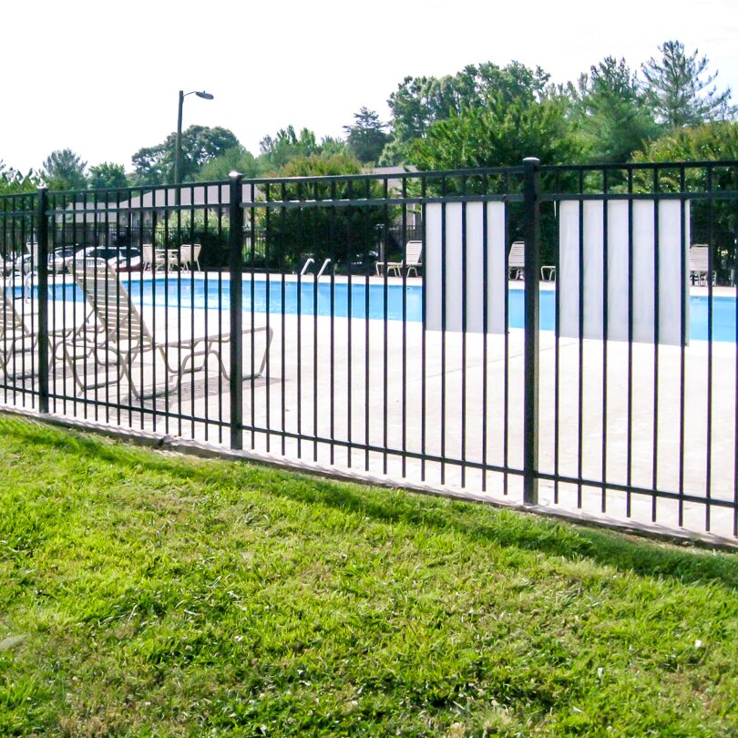 Flat top extruded bottom, three rail fencing surrounding a public pool