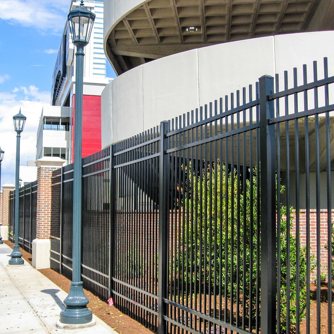 Heavy duty extruded top extruded bottom four rail panels surrounding a government building