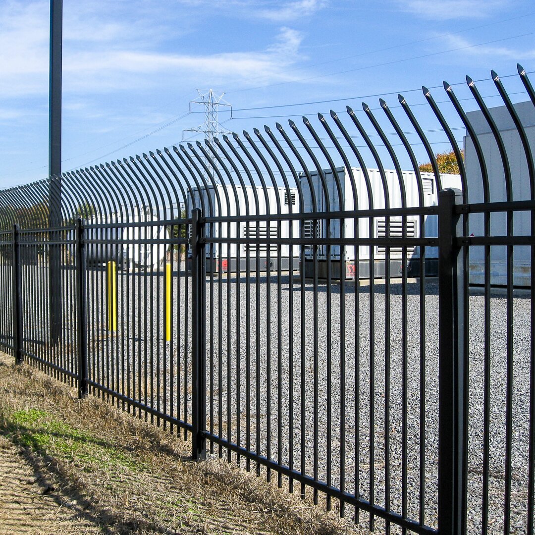 Anti-climb pressed spear, extruded bottom, three rail fencing surrounding a power substation