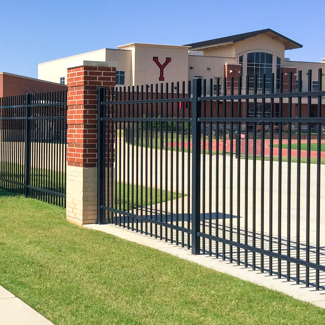 Extruded top extruded bottom, three rail, commercial fencing surrounding a public school