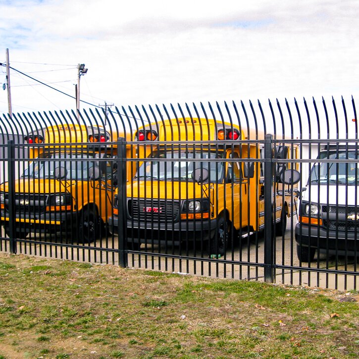 Anti-climb press spear, extruded bottom, three rail, heavy duty, fencing around a school bus parking lot