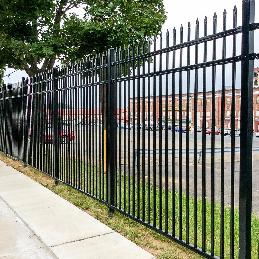Press spear, flat, bottom, commercial, fencing, three rail in front of a grocery store
