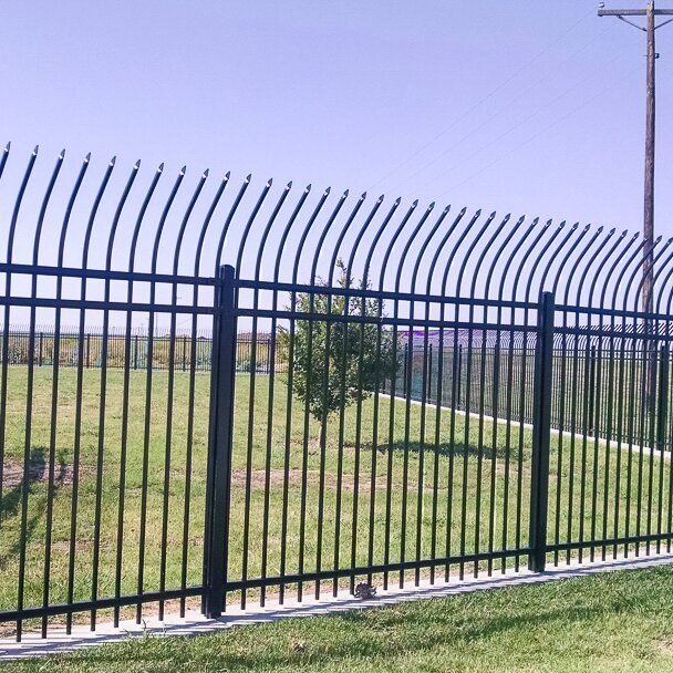 Anti-climb pressed spear, extruded bottom, three rail fencing surrounding a secure property