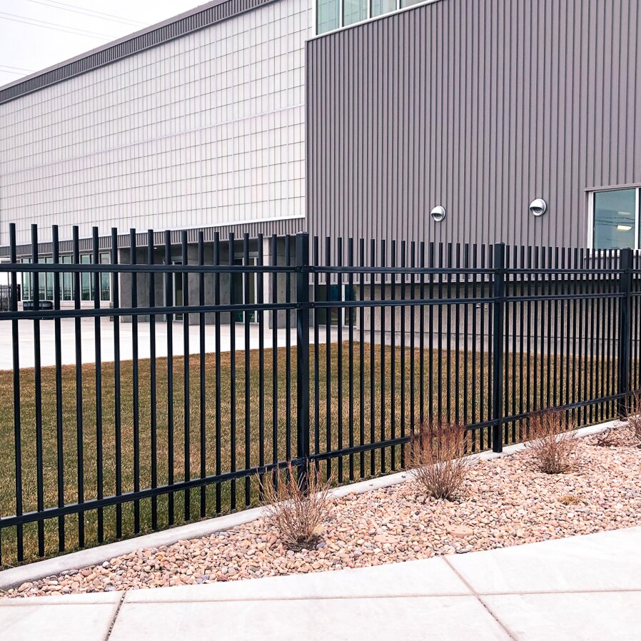 Extruded top extruded bottom three rail commercial fencing